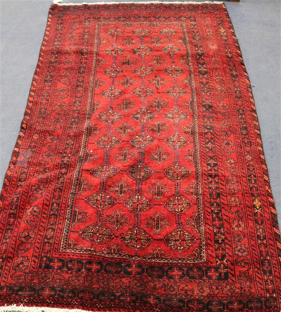 A Turkoman red ground rug, 7ft 5in by 4ft 3in.